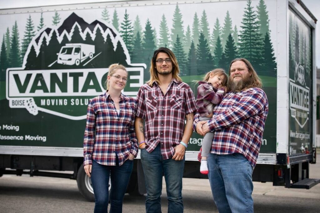 Brent Caito and family in front of a Vantage Moving truck