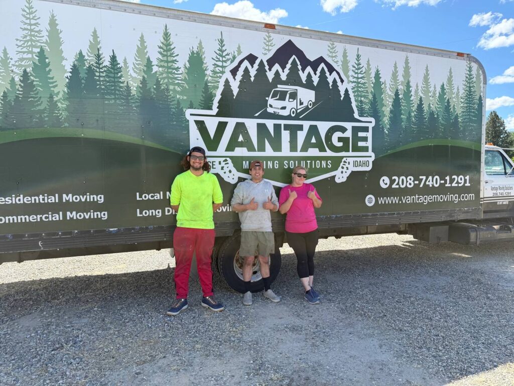 Vantage Moving crew standing in front of a branded truck