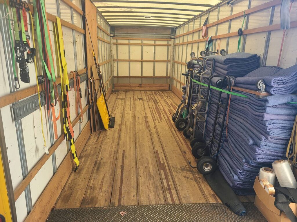 Inside a Vantage truck: pads, dollies and straps ready